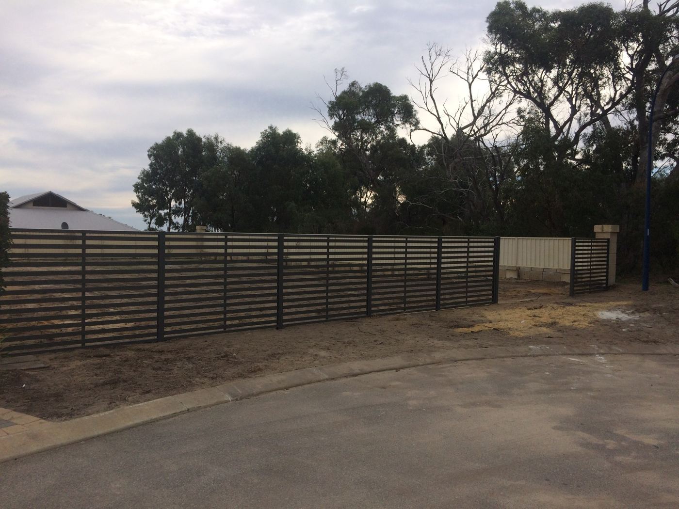 Slat fence along the verge